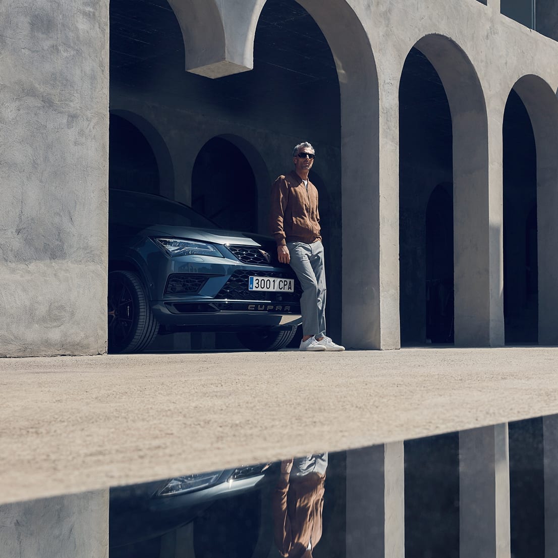 CUPRA driver leaning on his CUPRA Ateca